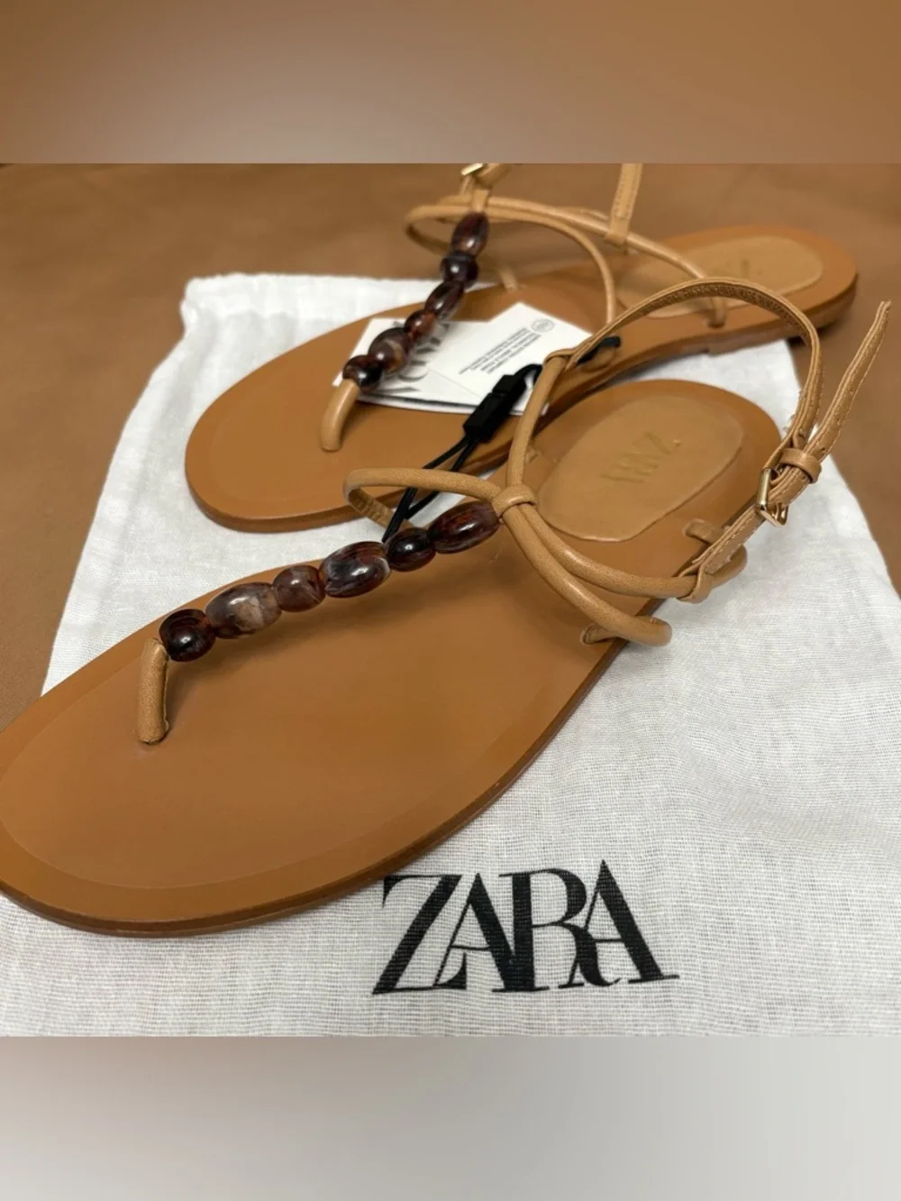 ZARA Tan Leather Beaded T-Strap Sandals
6.5 (37) NWT - Picture 2 of 7